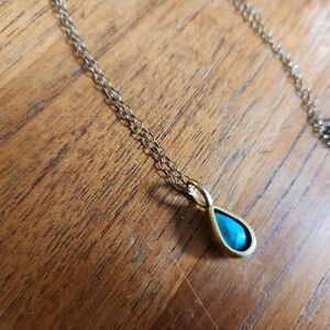 Blue Stone Pendant With Gold Casing And Chain